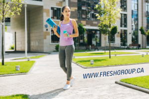 a young woman going to the gym, www.freshgroup.ca
